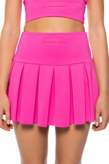 ITS THE PAXTON LUXE PLEATED SKORT IN NEON PINK