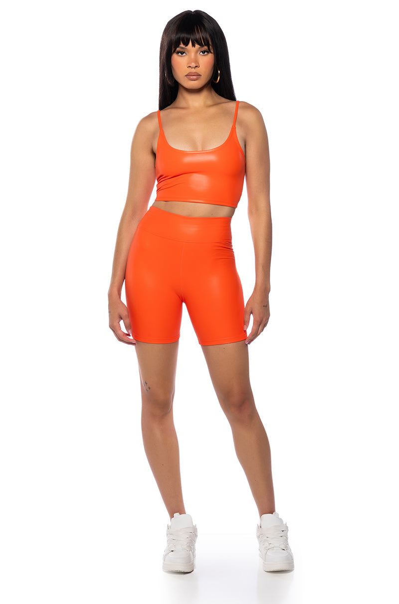 RIO FAUX LEATHER BIKER SHORT IN ORANGE